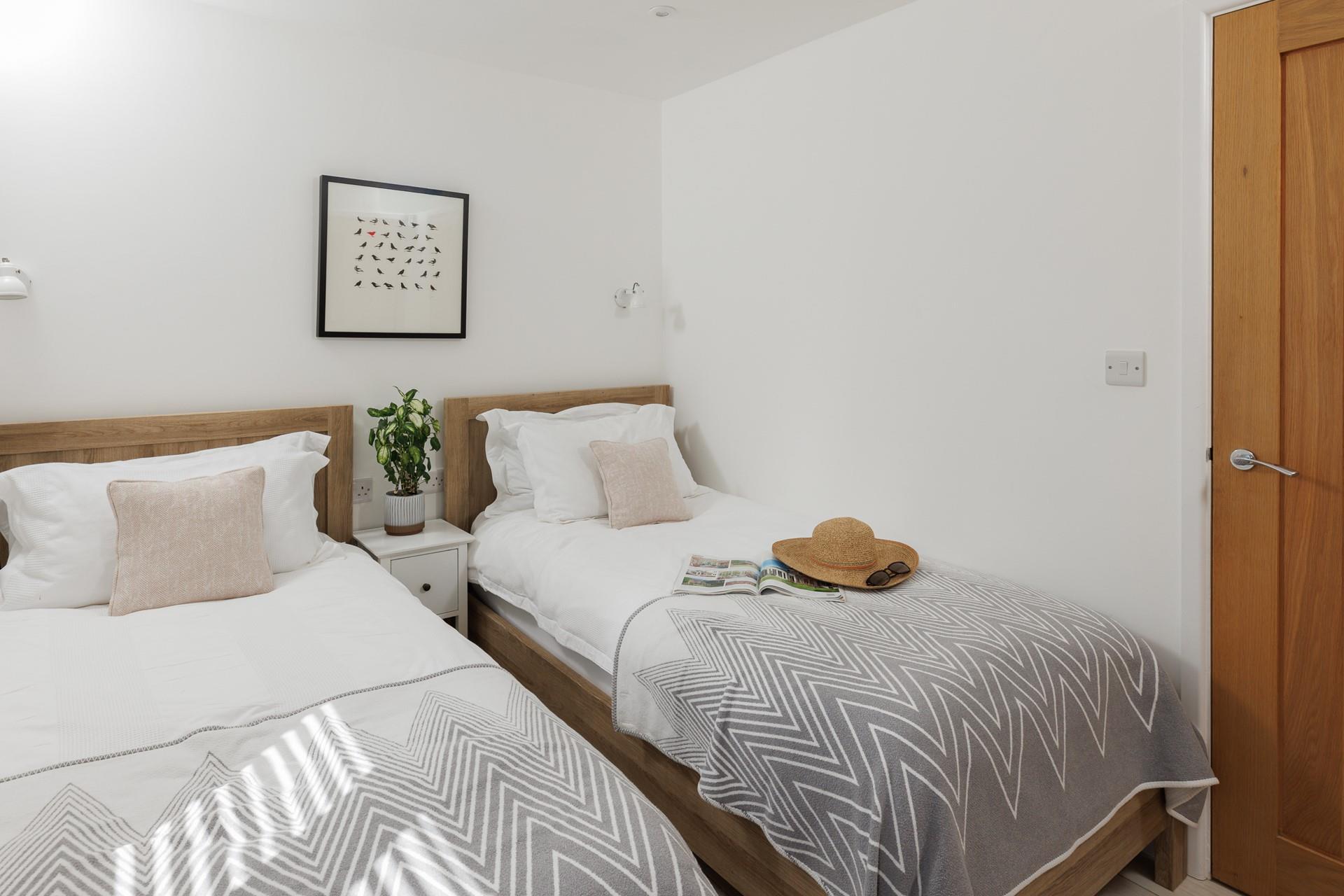 Twin beds are suitable for adults and children alike.