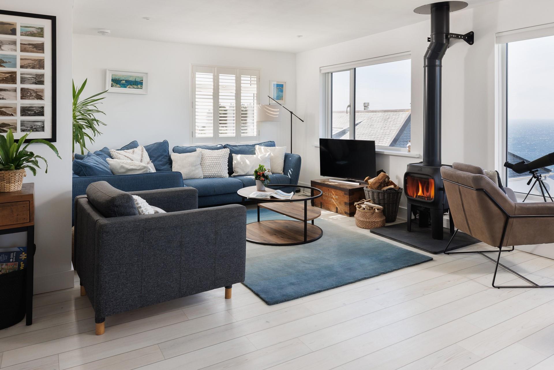 Relax in the sitting area, watching the ever-changing ocean vista.