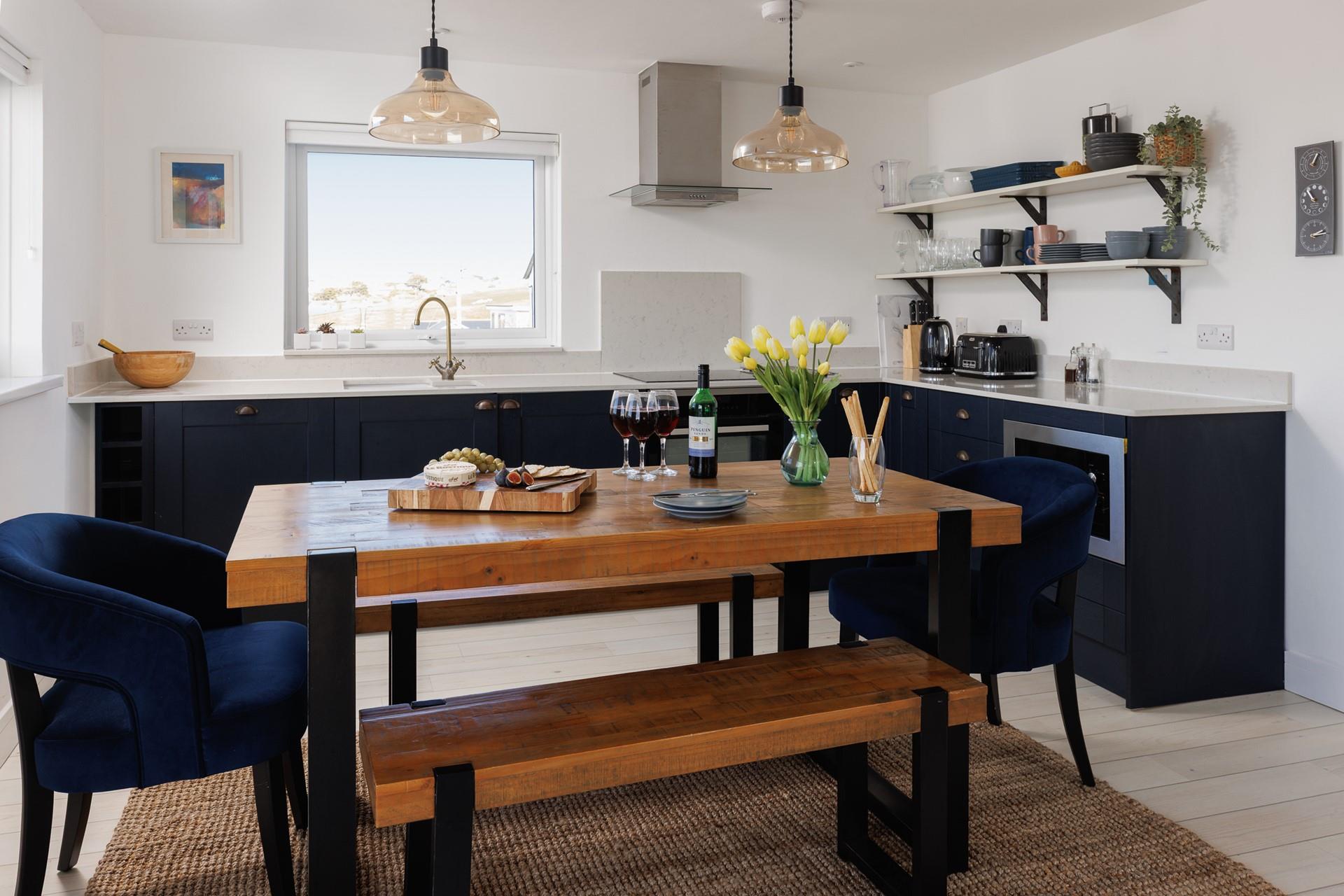 The chic kitchen and dining space is a delight to cook and eat in.