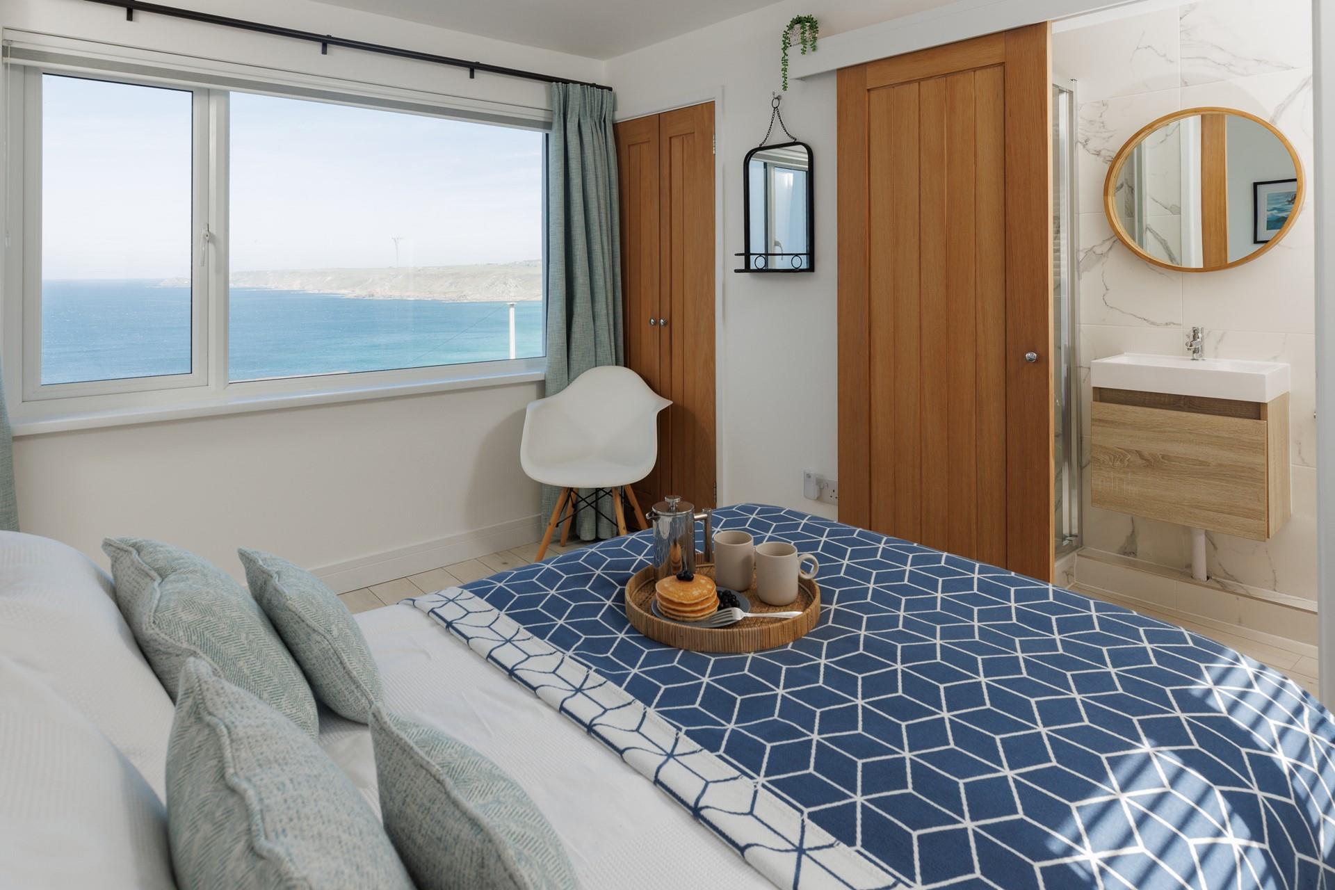Modern decor and coastal blues adorn bedroom 3.