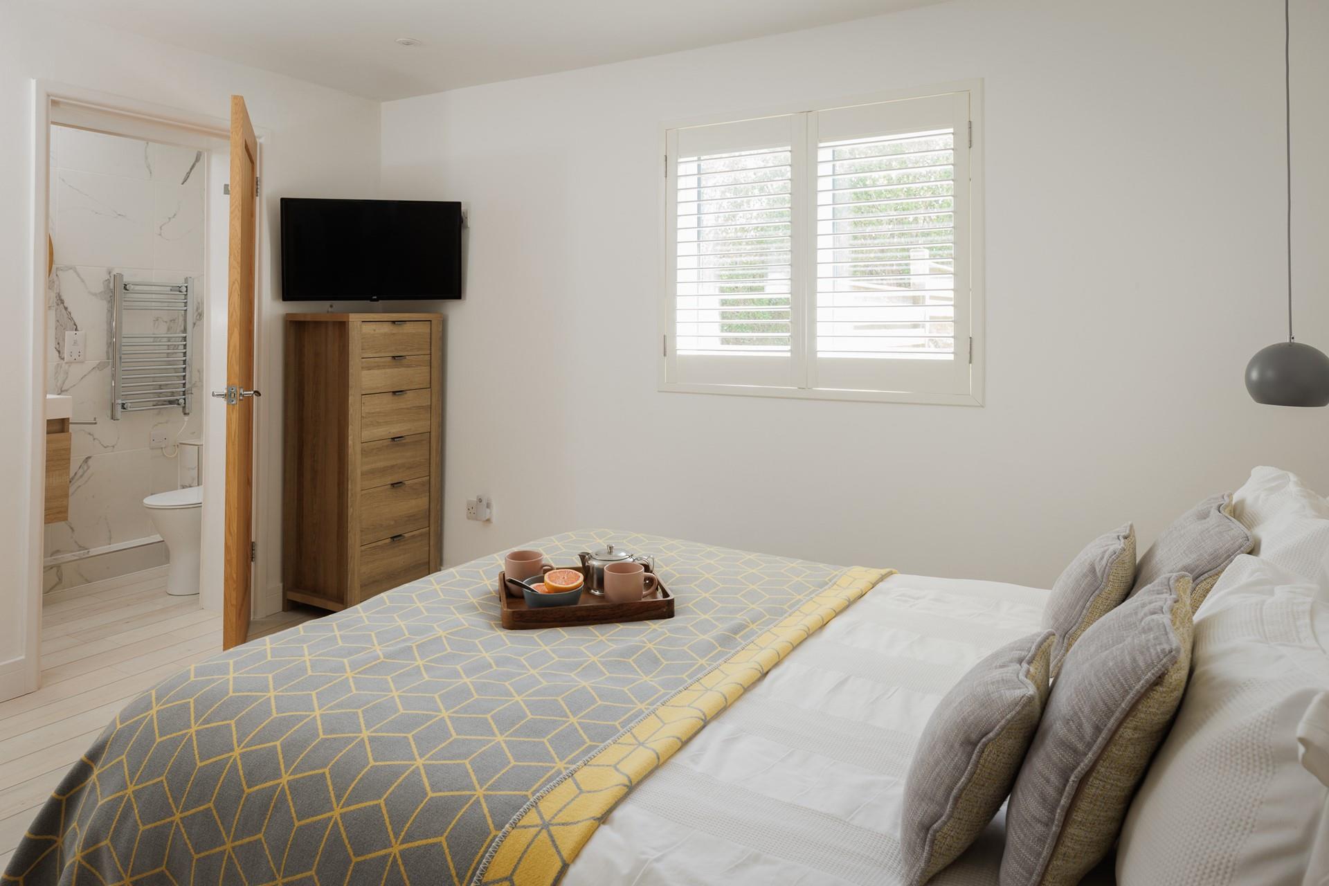 Rustic wood and soft linens create a calming retreat.