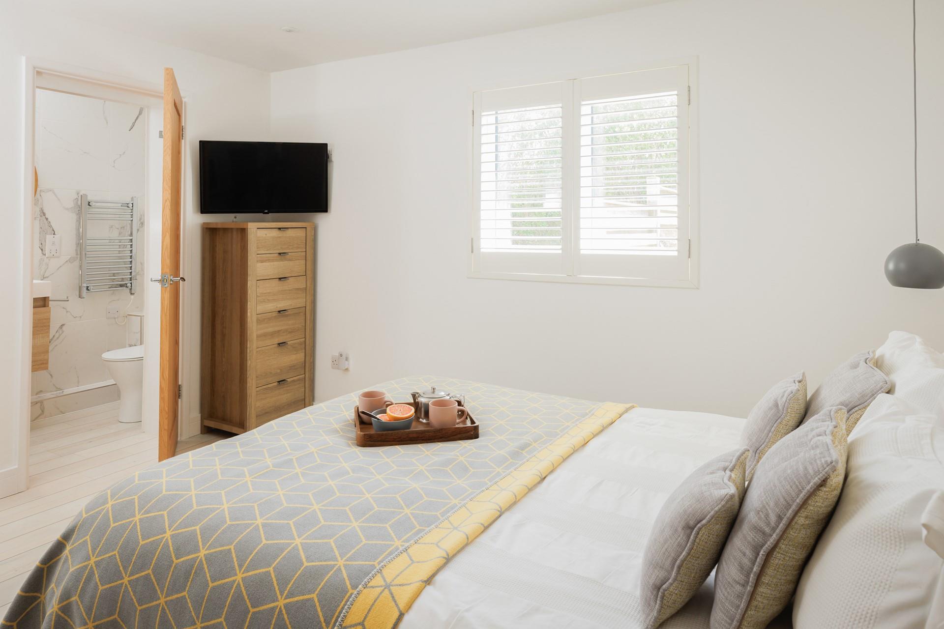 Rustic wood and soft linens create a calming retreat.