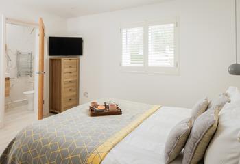 Rustic wood and soft linens create a calming retreat.