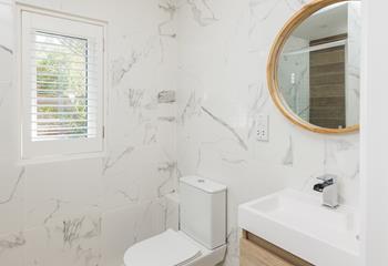 Spa-like decor creates a calming feel in each en suite.