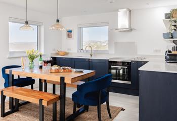 The chic kitchen and dining space is a delight to cook and eat in.