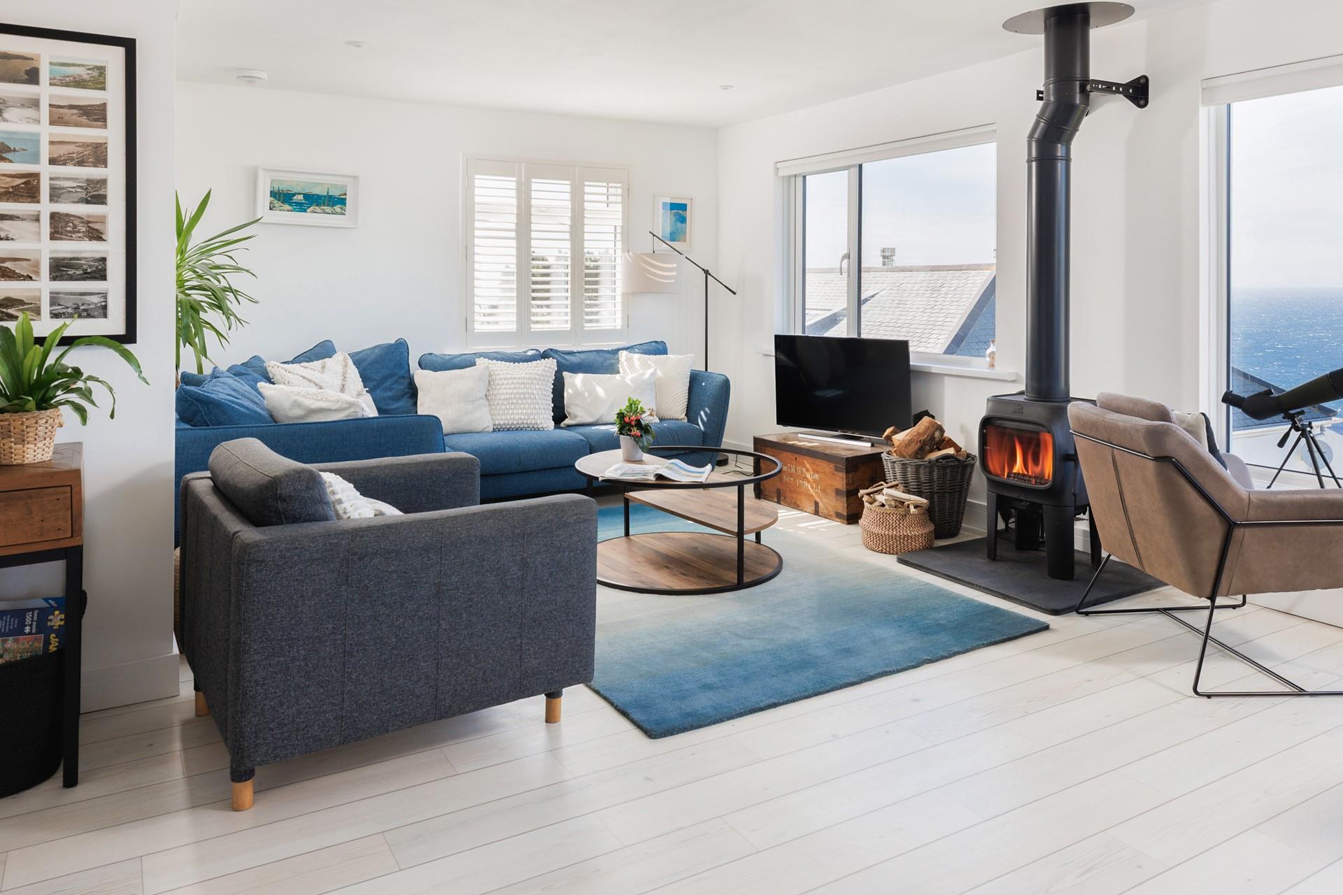 Relax in the sitting area, watching the ever-changing ocean vista.