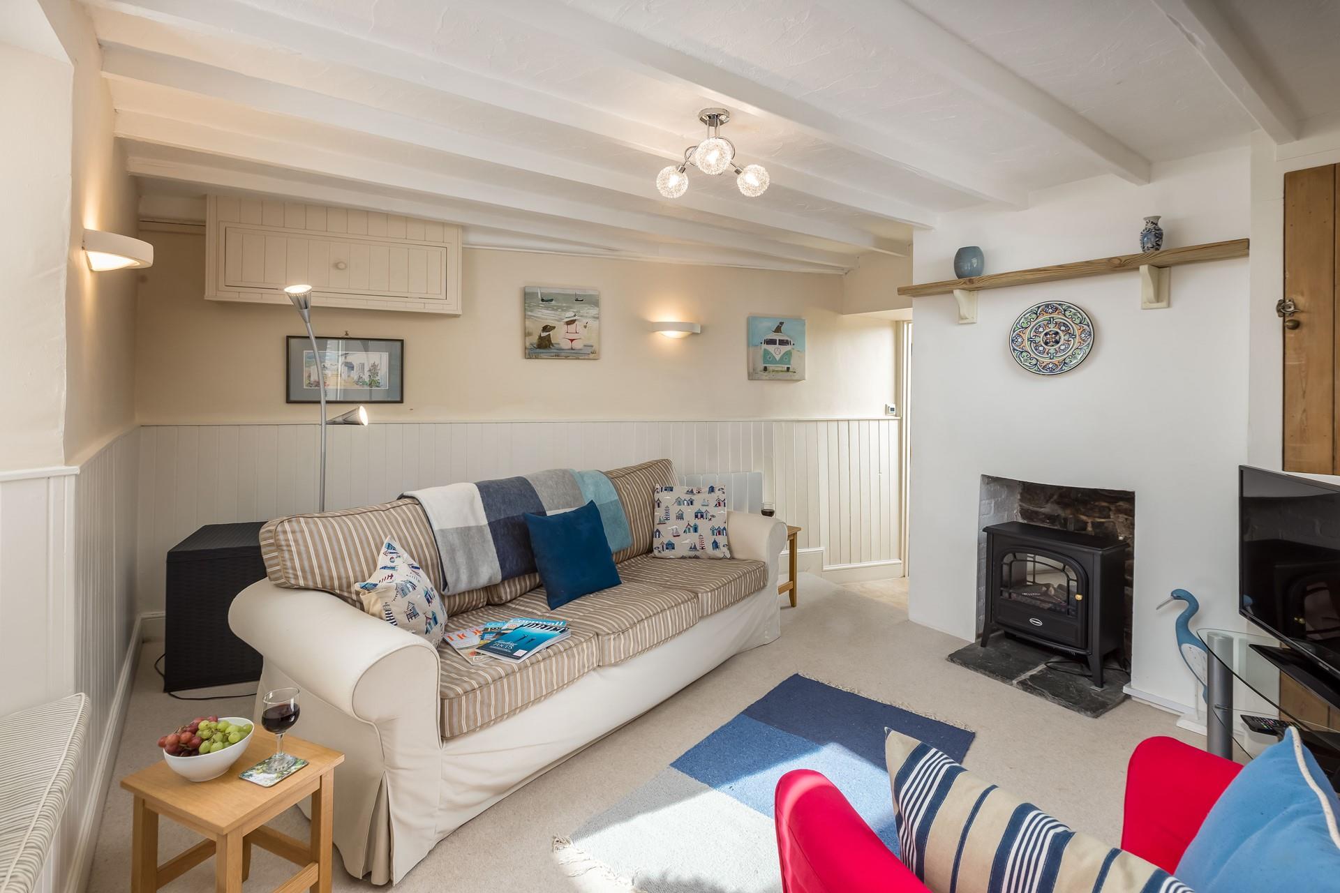 The sitting room has a super comfy sofa for lazy evenings spent relaxing.