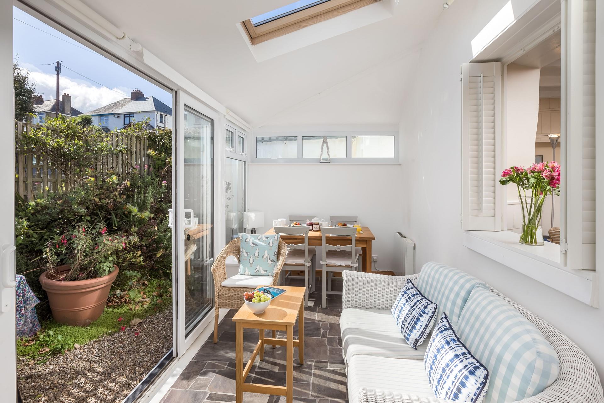 The sunroom is the perfect place to relax and unwind with the fresh summer breeze running through.