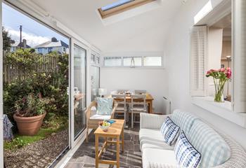 The sunroom is the perfect place to relax and unwind with the fresh summer breeze running through.