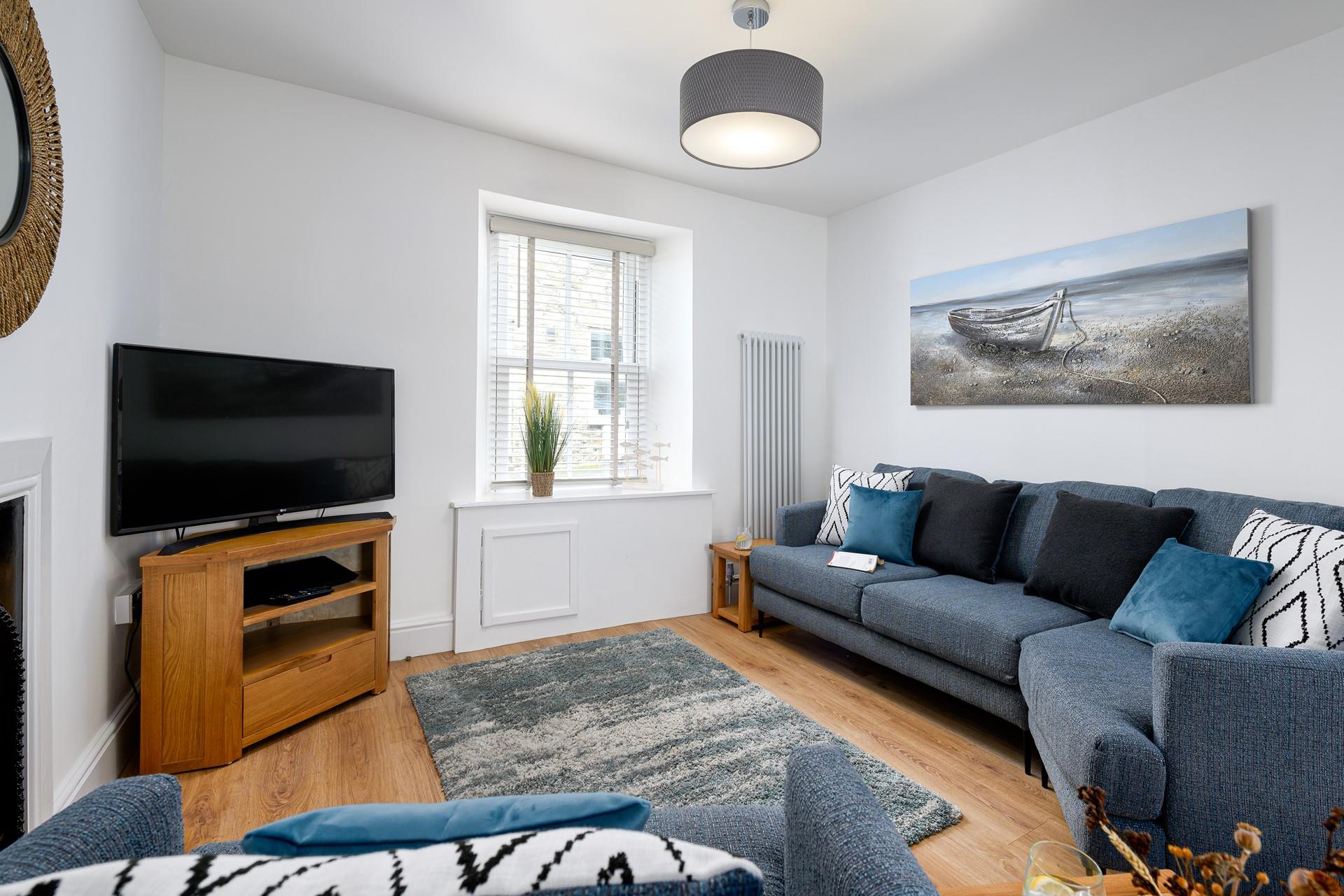 Get cosy in the living area and enjoy your favourite film on the smart TV.