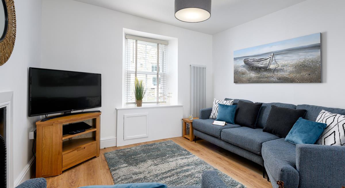 Get cosy in the living area and enjoy your favourite film on the smart TV.