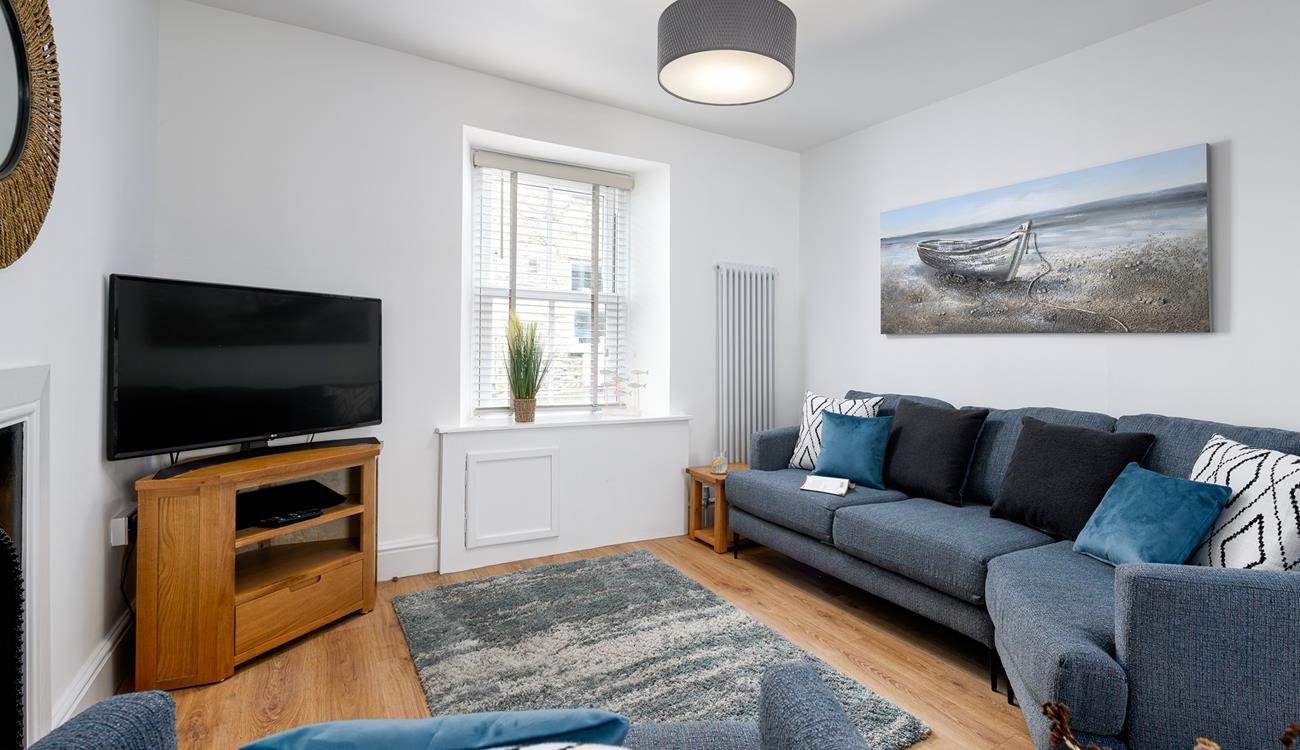 Get cosy in the living area and enjoy your favourite film on the smart TV.