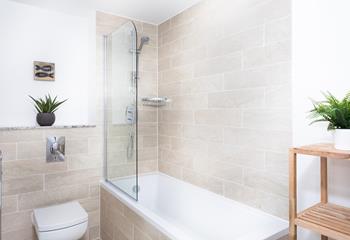 The family bathroom offers a bath and shower, so you can relax after a busy day at the beach.