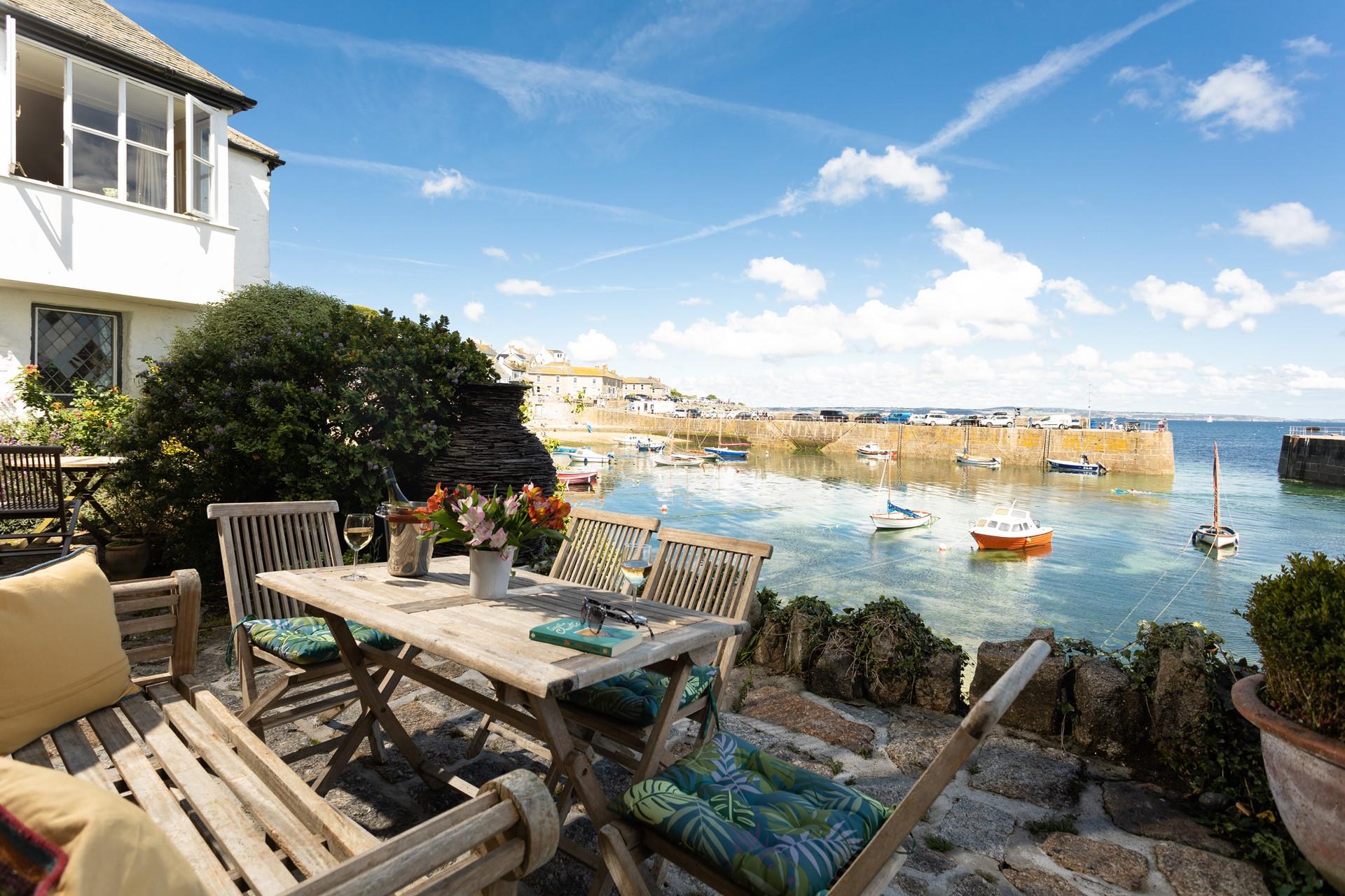 Watch the comings and goings of the harbour from the cobbled terrace.