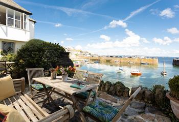Watch the comings and goings of the harbour from the cobbled terrace.