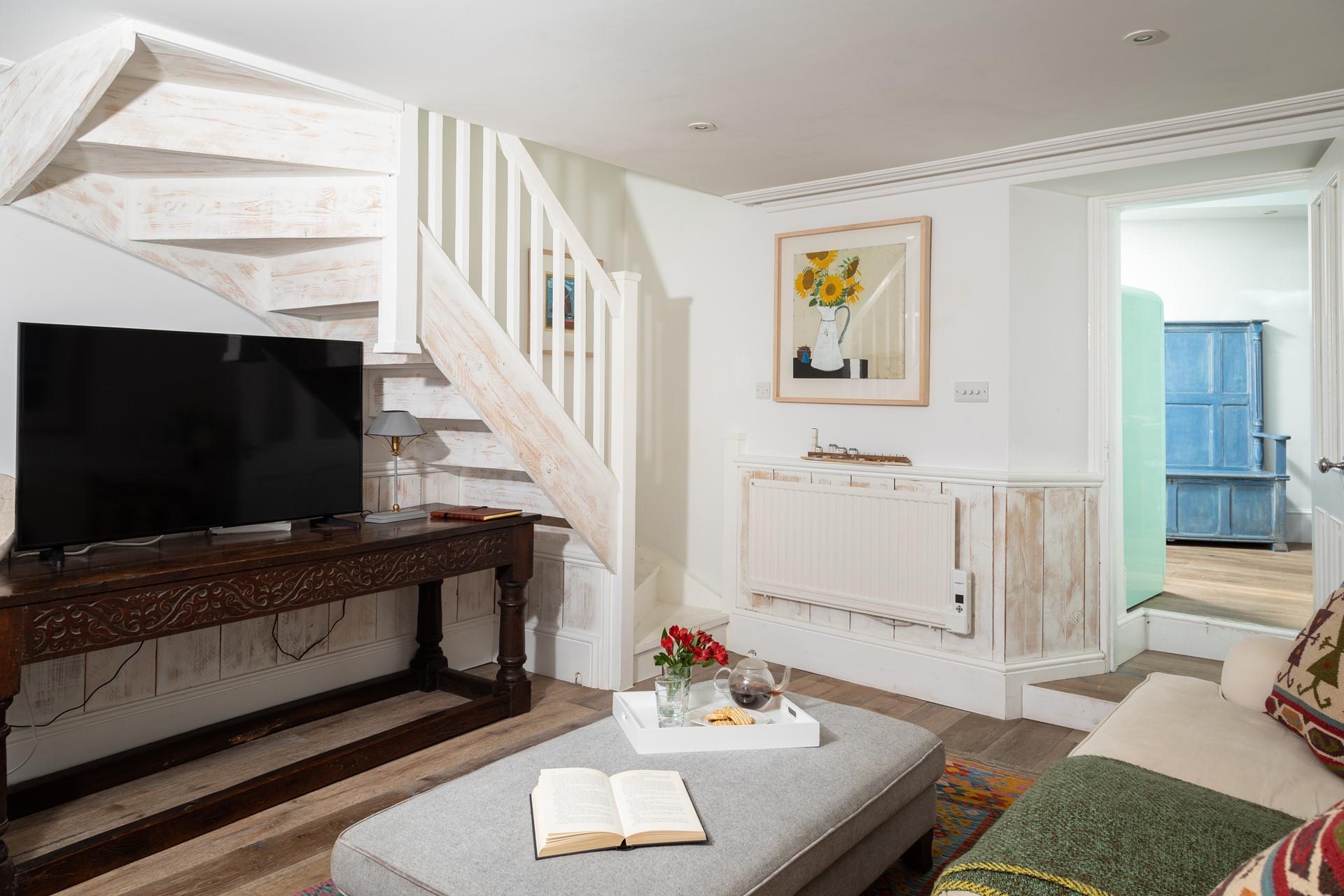 Enjoy a family movie night in the sitting room with a glass of your favourite tipple.