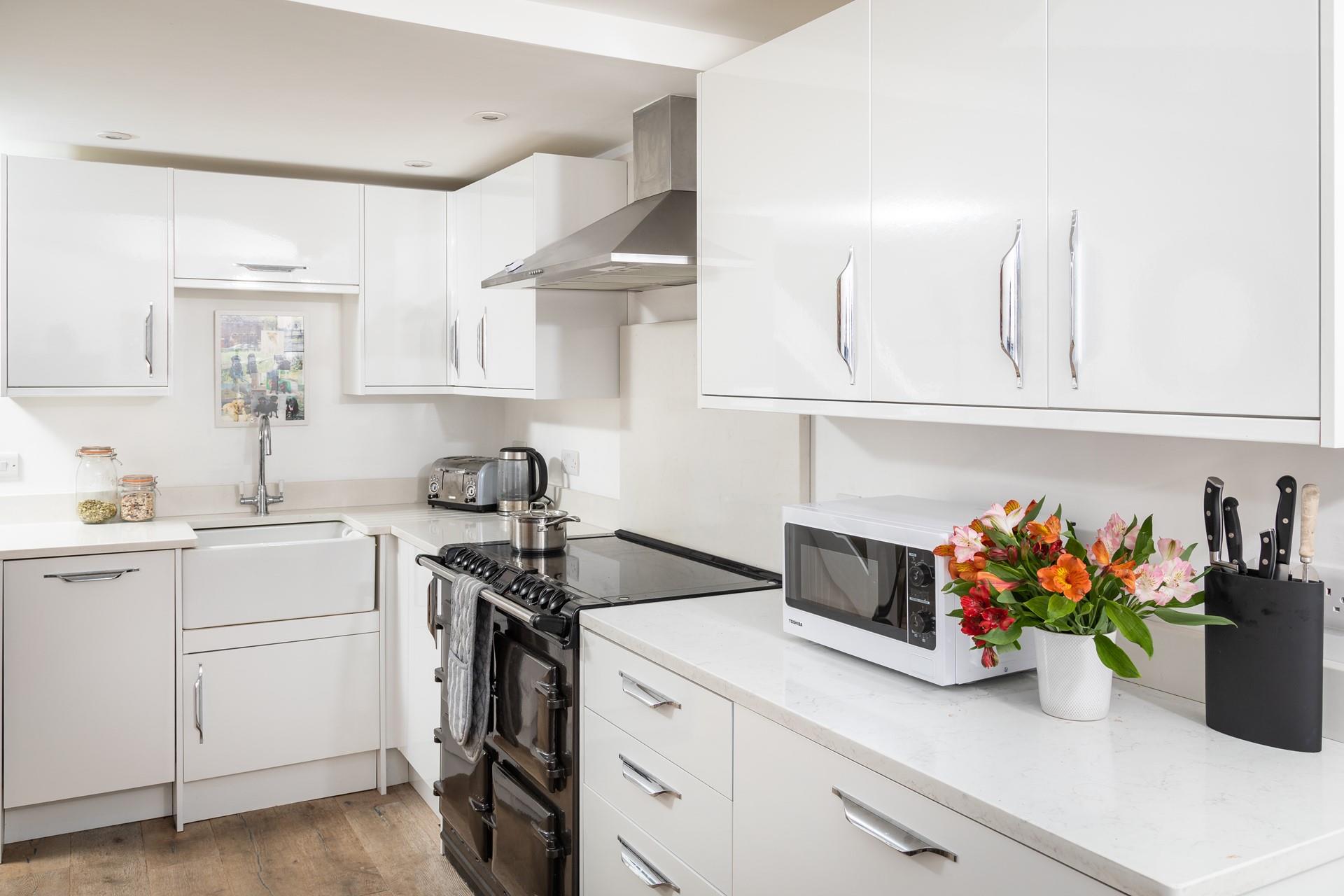 The modern kitchen is well-equipped for all your cooking needs.