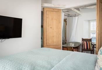 Wander out of bed and through the wooden doors to the bedroom.
