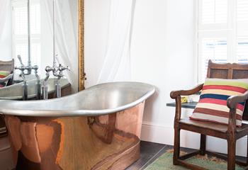Relax and unwind in the copper bath after a day walking the coast path.