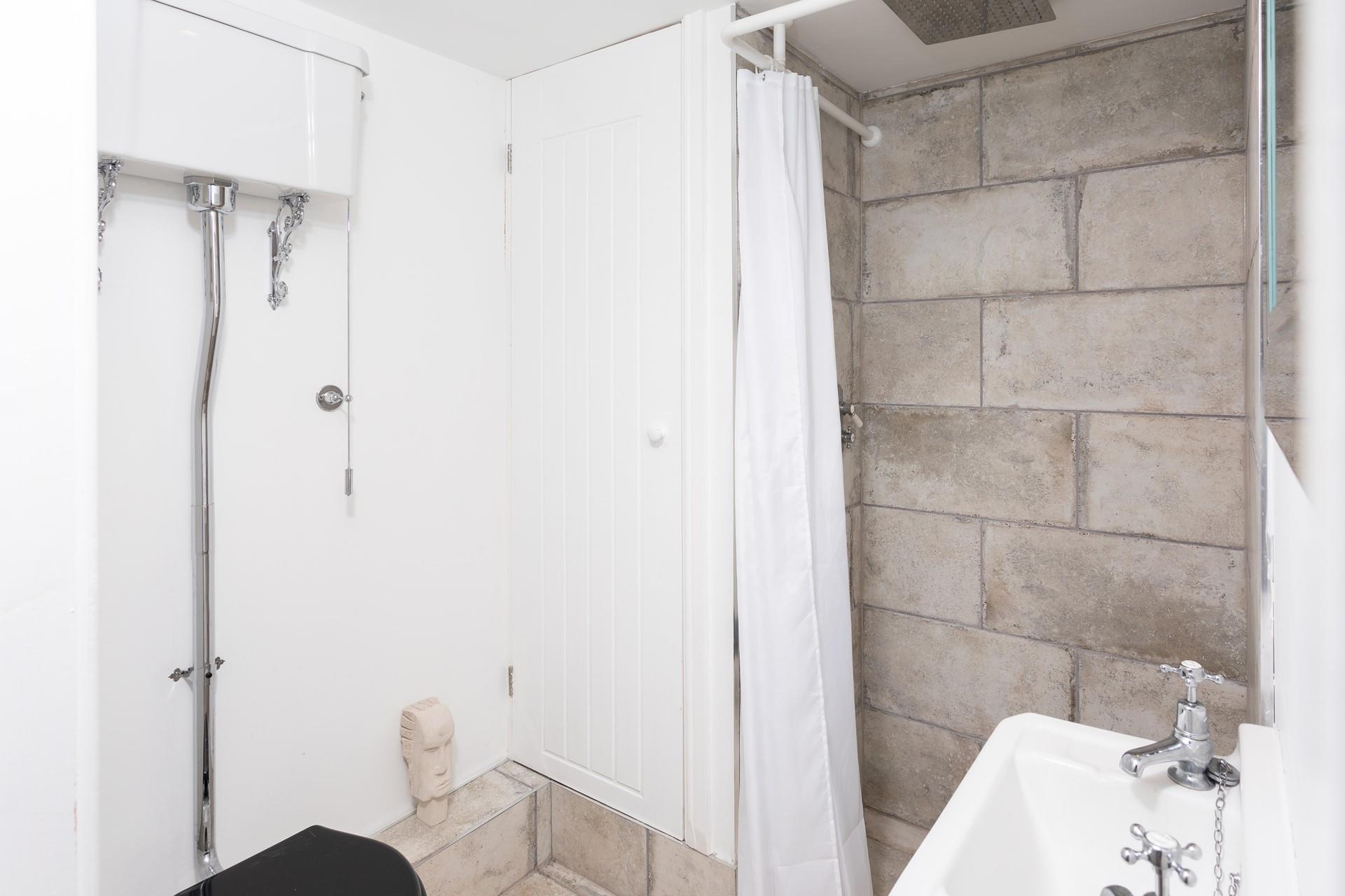 Wash off your sandy toes in the walk-in rainfall shower.