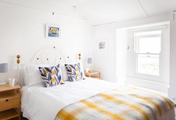 The comfortable king size bed promises a blissful night's sleep, and in the morning watch the waves crashing onto Porthmeor beach from the window.