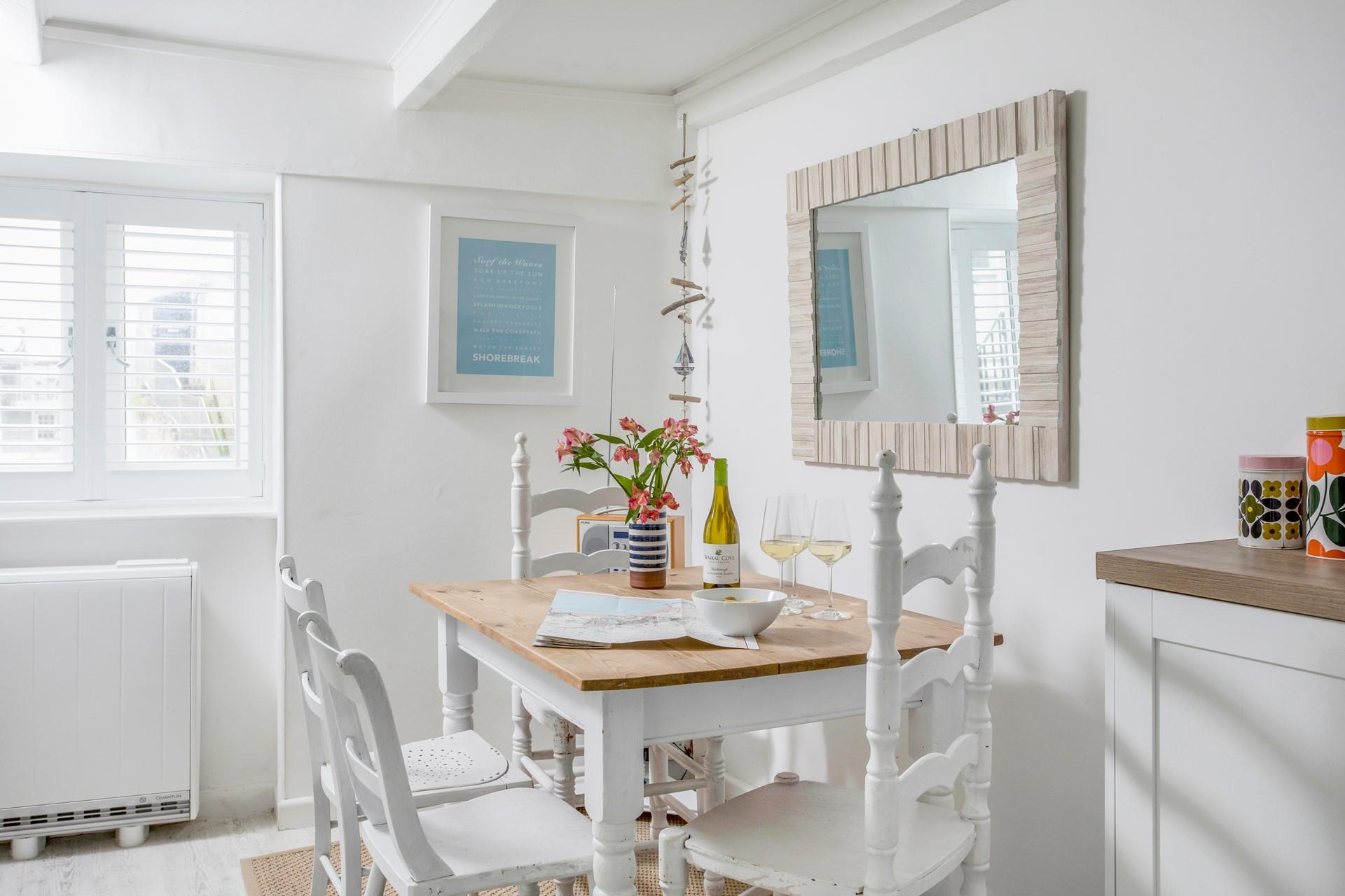 The nautical theme continues into the kitchen which has plenty of space to dine, and is exceptionally well equipped.