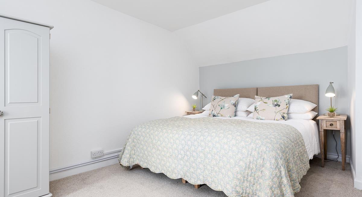 The large bed with a comfortable mattress promises you a good night's sleep leaving you rested and ready for the day ahead.