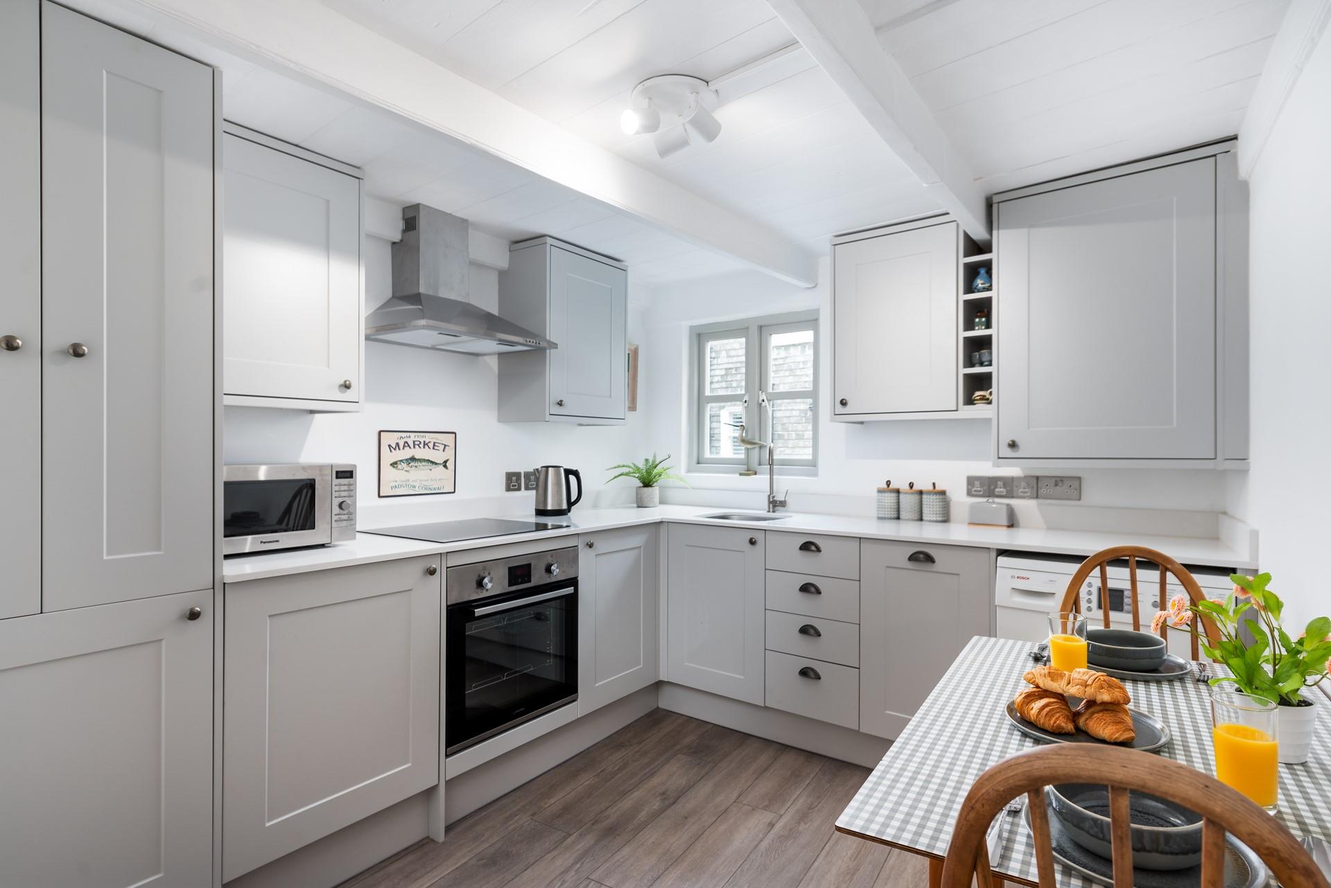 Start your day by enjoying fresh croissants with lashings of Cornish butter at the charming little dining table.