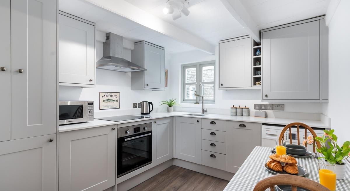 Start your day by enjoying fresh croissants with lashings of Cornish butter at the charming little dining table.