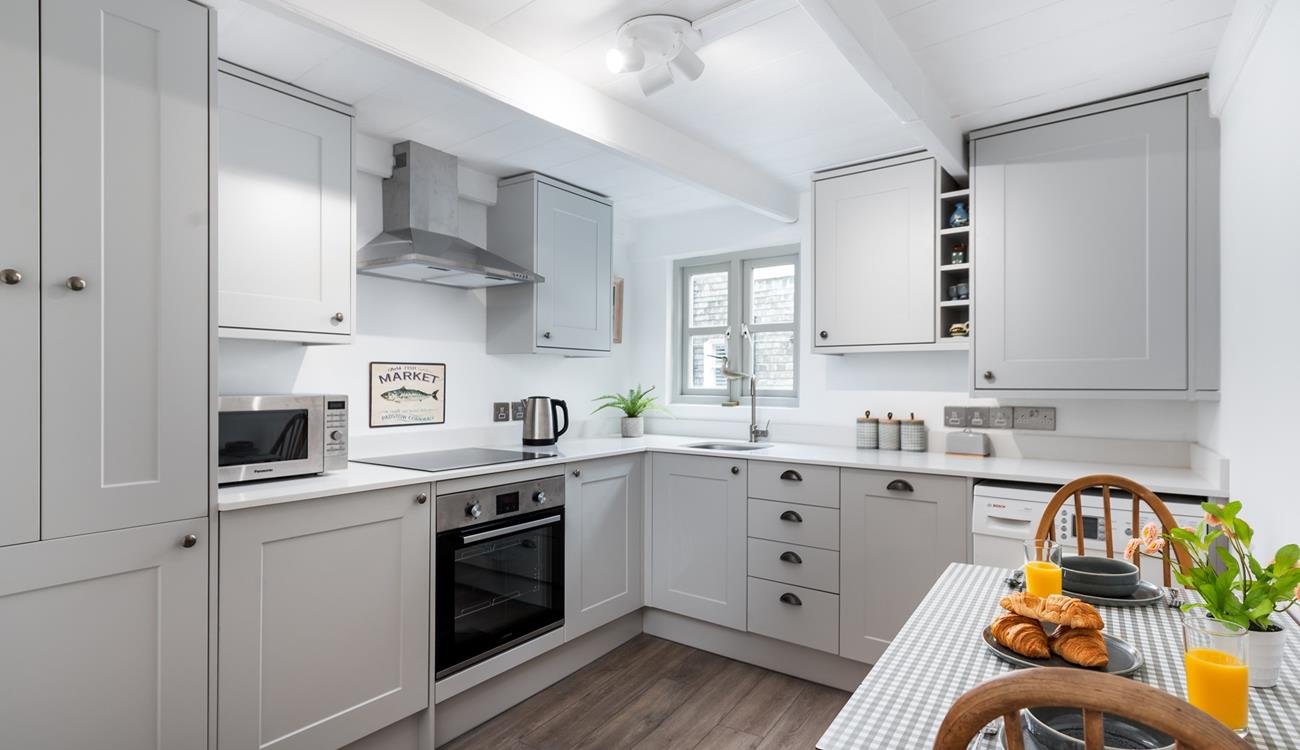 Start your day by enjoying fresh croissants with lashings of Cornish butter at the charming little dining table.