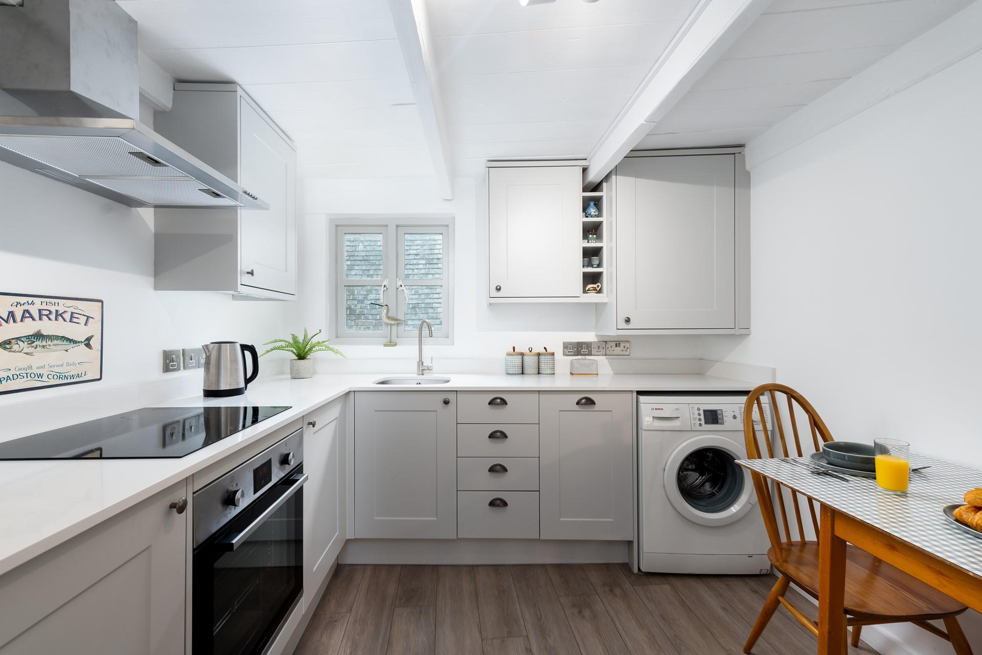 The sleek kitchen is fabulously well-equipped and with local delis nearby you will be able to pick up fresh produce easily.