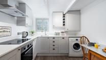 The sleek kitchen is fabulously well-equipped and with local delis nearby you will be able to pick up fresh produce easily.