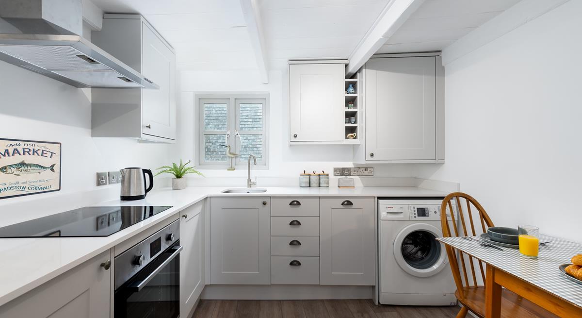 The sleek kitchen is fabulously well-equipped and with local delis nearby you will be able to pick up fresh produce easily.