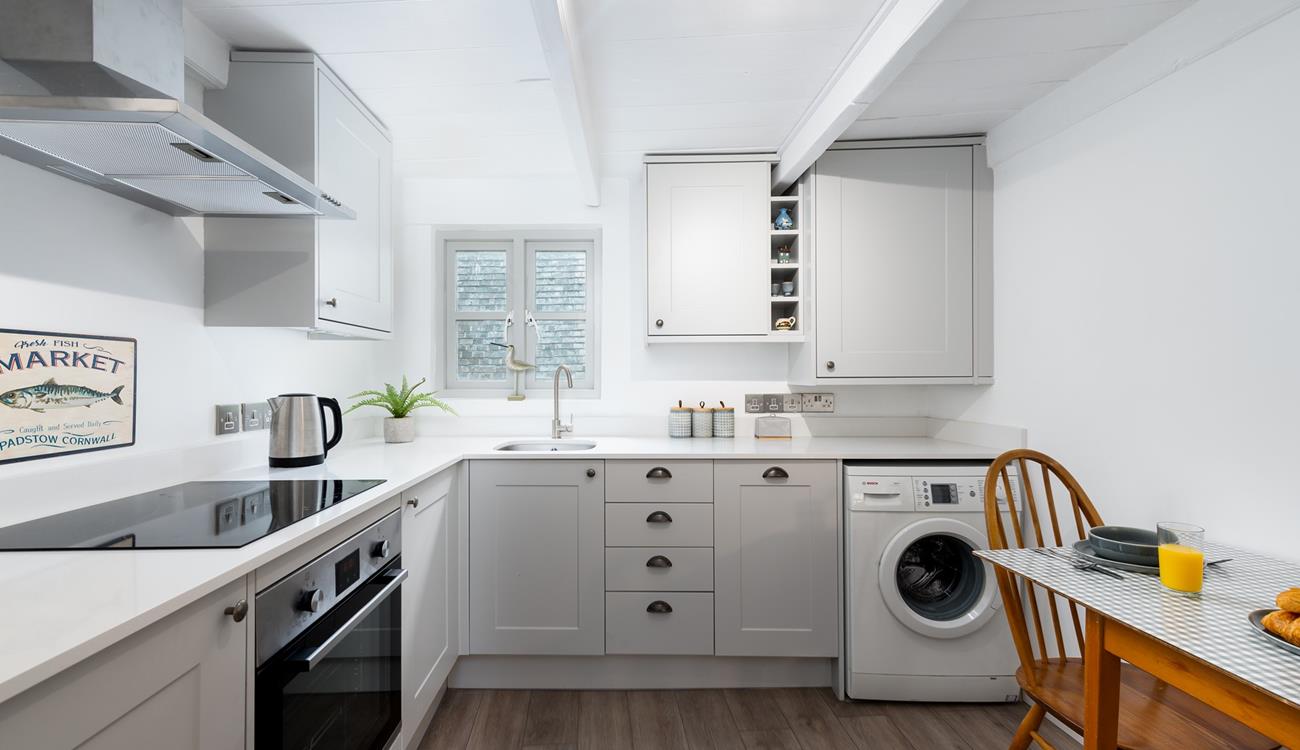 The sleek kitchen is fabulously well-equipped and with local delis nearby you will be able to pick up fresh produce easily.