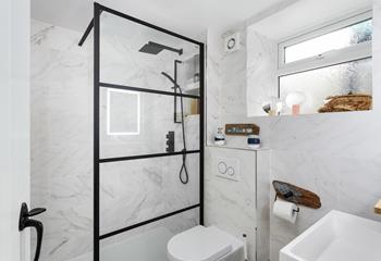 The stylish bathroom is the perfect space to get ready.
