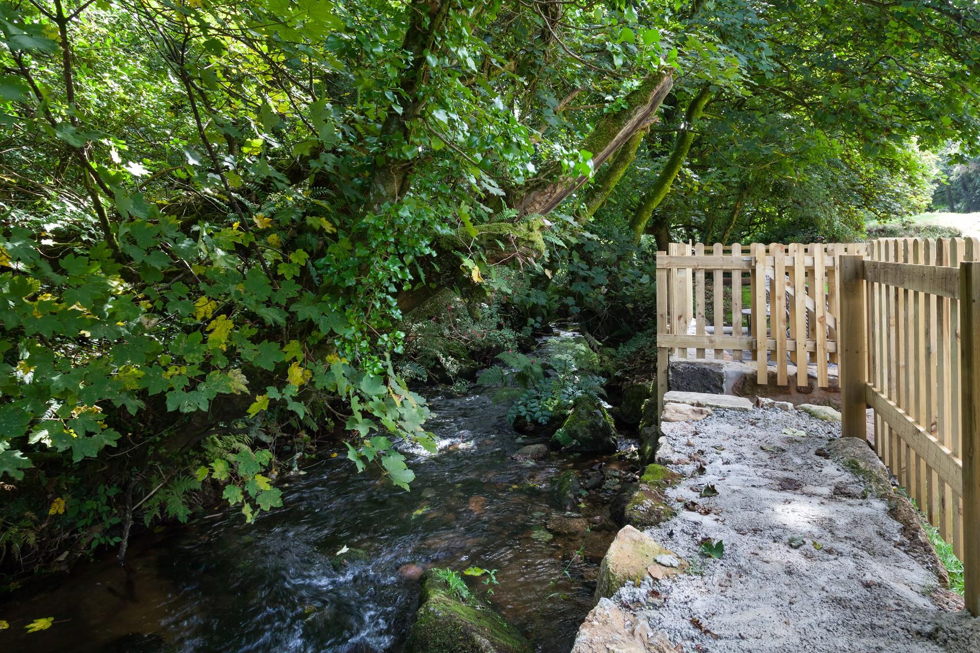 There is a lovely stream at the bottom of the garden for dipping toes on summer days.