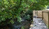 There is a lovely stream at the bottom of the garden for dipping toes on summer days. - Thumbnail Image