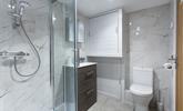 The sleek bathroom is the perfect space to get ready each day. - Thumbnail Image