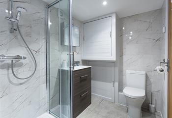 The sleek bathroom is the perfect space to get ready each day.