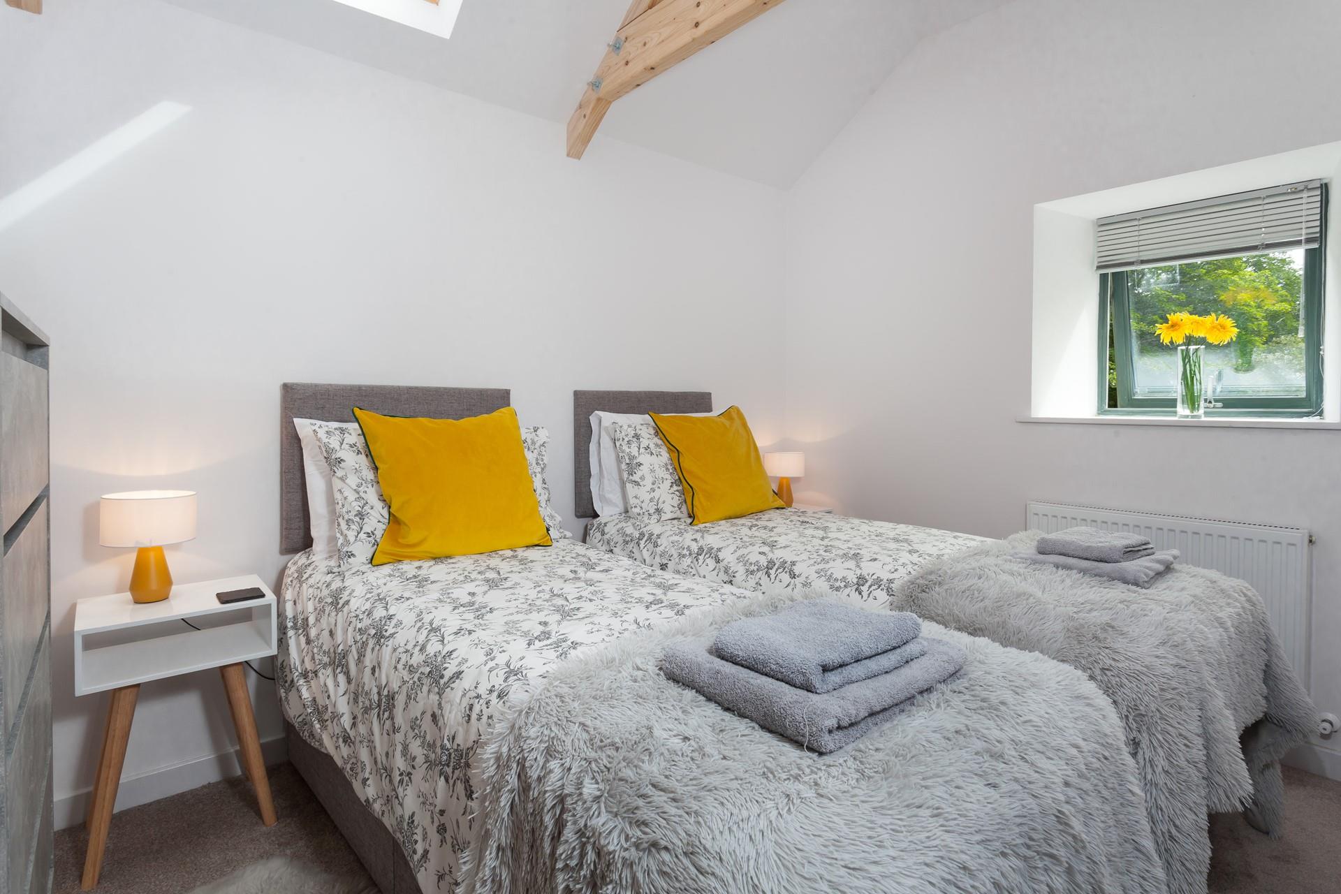 Bedroom 2 has zip and link beds allowing for flexible sleeping arrangements.