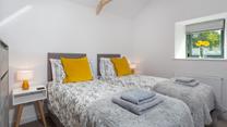 Bedroom 2 has zip and link beds allowing for flexible sleeping arrangements.