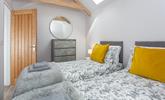 The bedrooms are decorated with greys and whites with a pop of colour. - Thumbnail Image