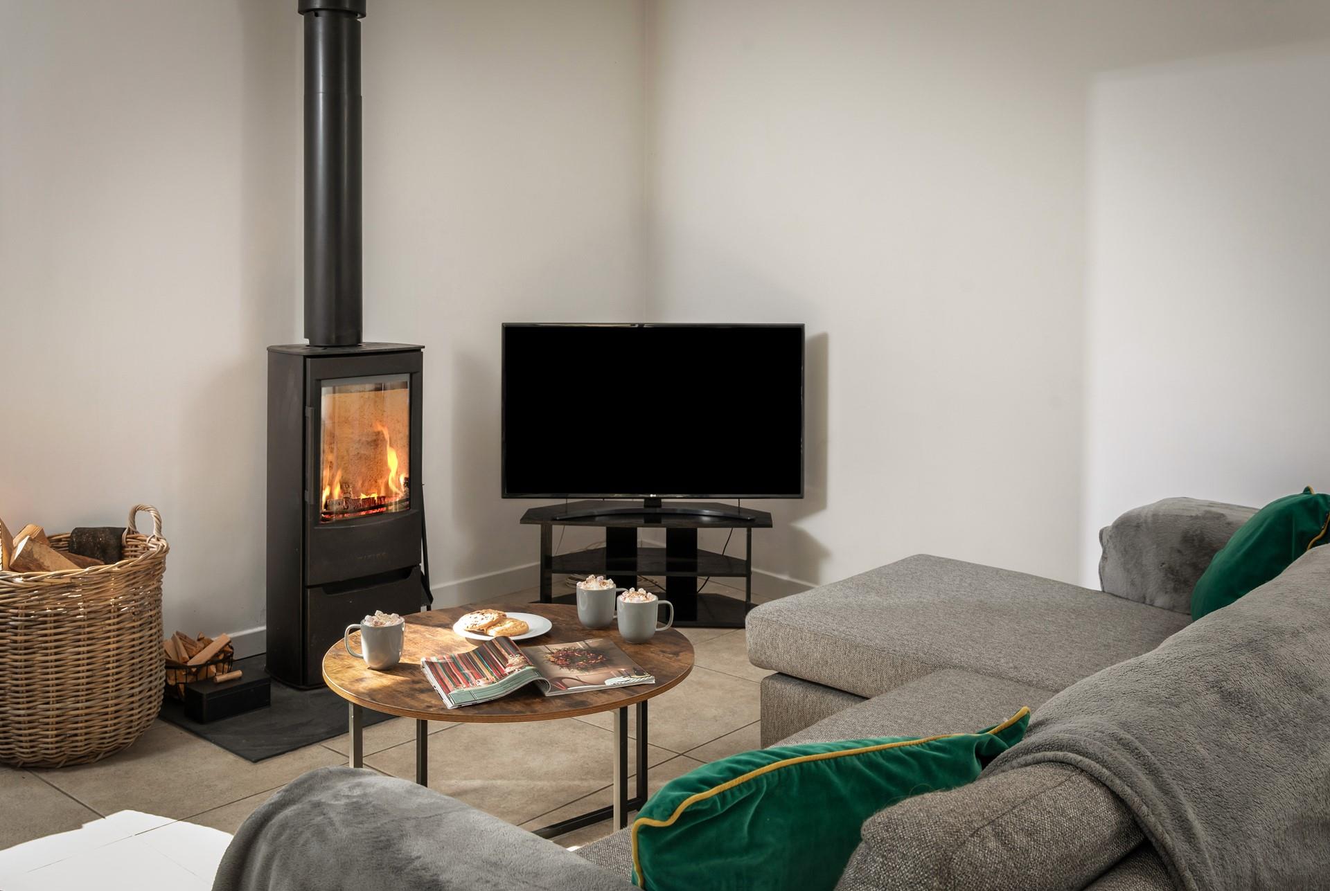 The cosy woodburner makes Boskennal Barn perfect for an autumn or winter break.