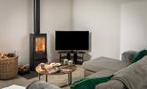 The cosy woodburner makes Boskennal Barn perfect for an autumn or winter break. - Thumbnail Image