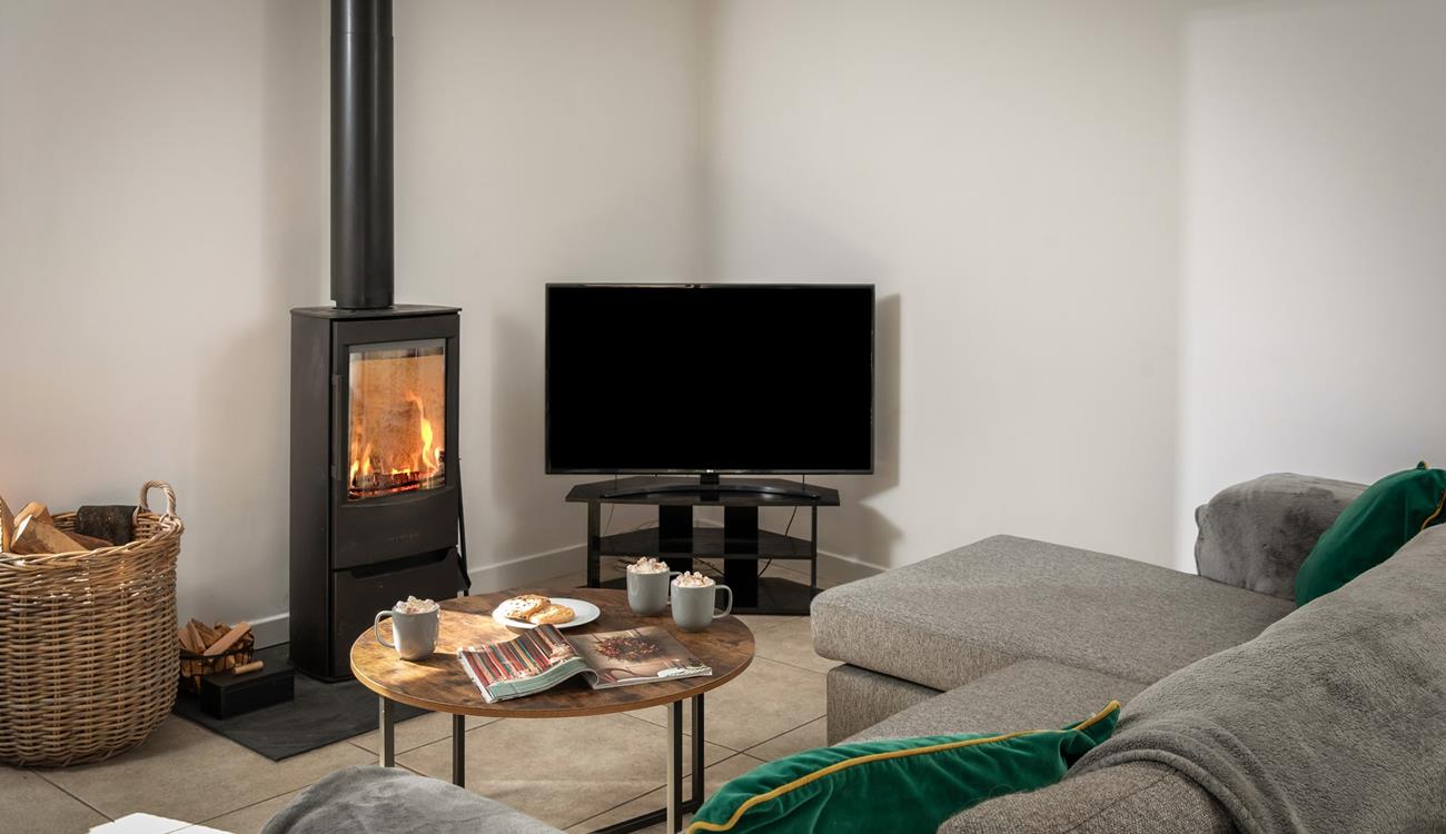 The cosy woodburner makes Boskennal Barn perfect for an autumn or winter break.
