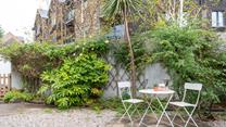 Relax in the garden over a lazy lunch and a glass of something cold.