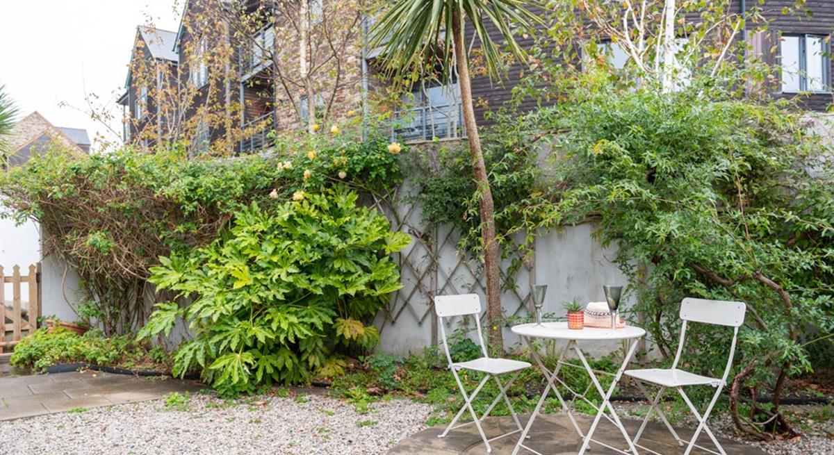 Relax in the garden over a lazy lunch and a glass of something cold.