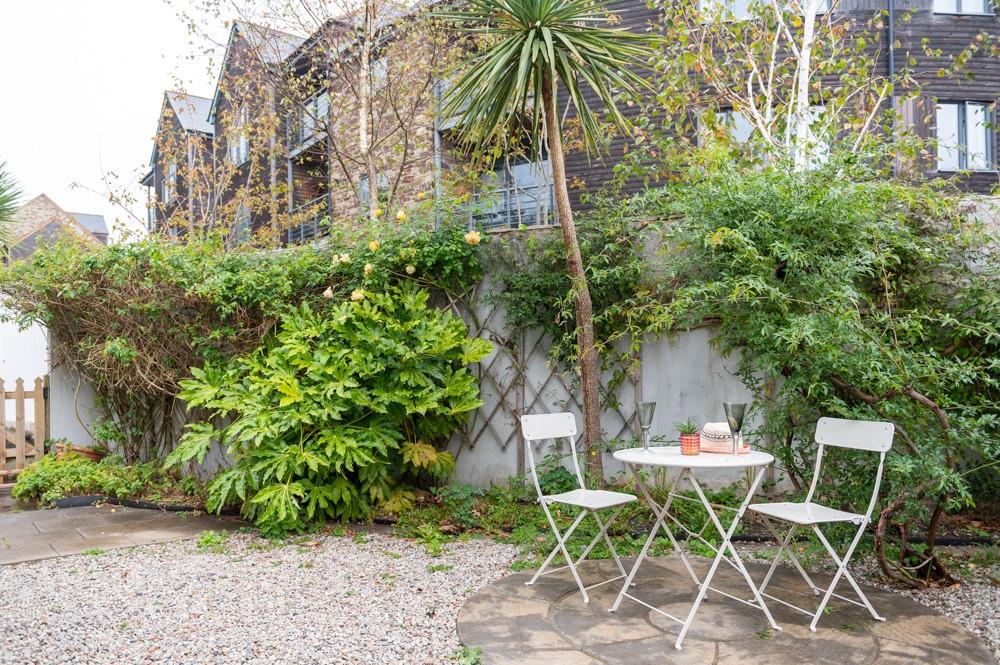 Relax in the garden over a lazy lunch and a glass of something cold.