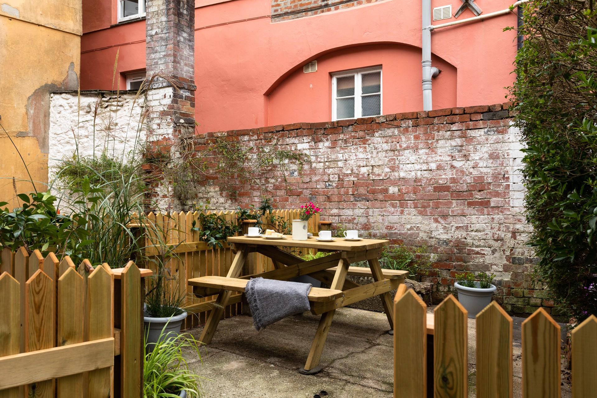 An enclosed courtyard is perfect for those bringing their four-legged family members with them!