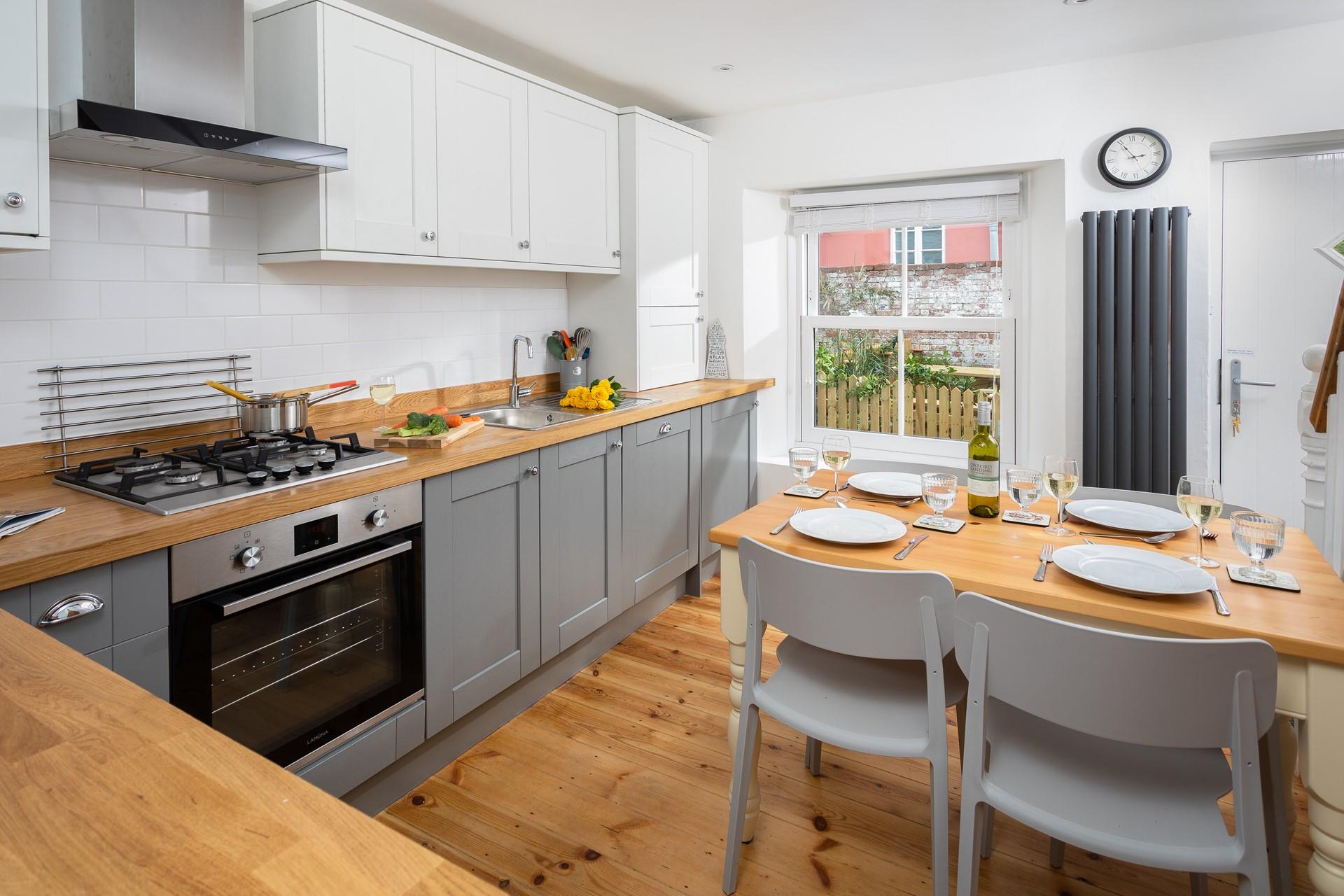 The kitchen is fabulously bright, spacious and modern, perfect for cooking family meals!